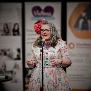 Vie peesenting a speech at an event