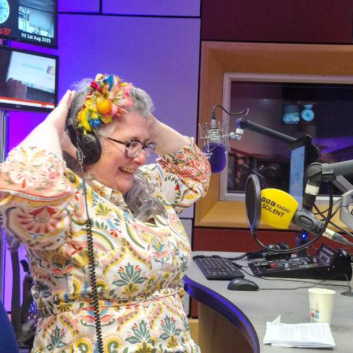 Vie sat withheadphones in the Radi Solent radio studio, beinginterviewed for a show.