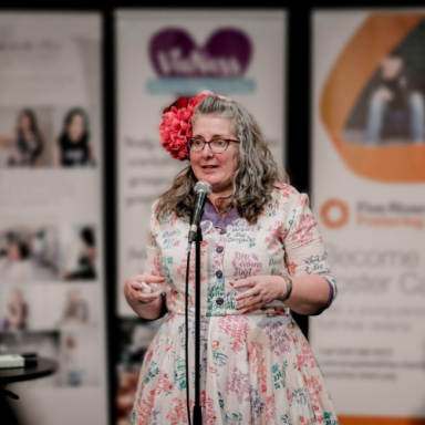 Vie addressing an audience at a Women's Day event she organised